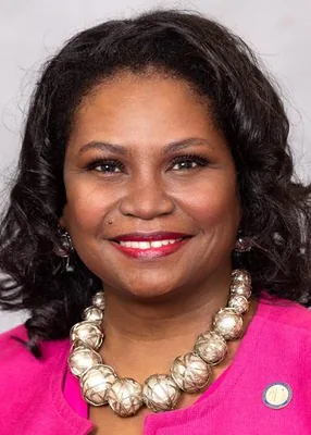 Official portrait of Aisha Dew